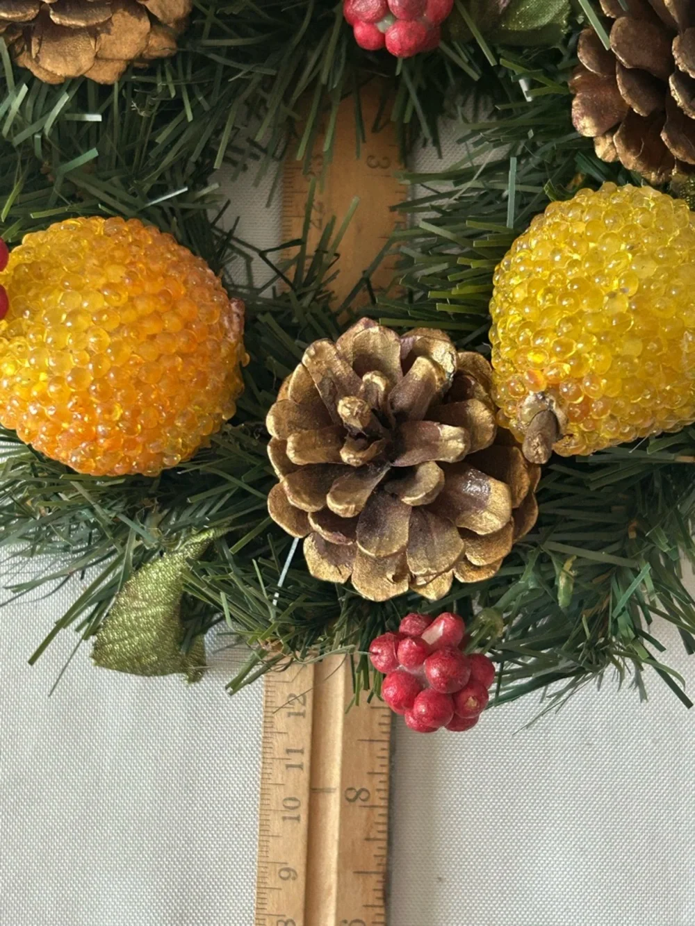 VTG artificial wreath/candle ring w/faux fruit, pinecones, and red berries.